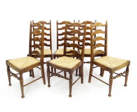 Set of six oak ladder back dining chairs with rush seats and turned supports united by stretchers (6)
