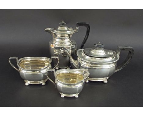 Silver four piece boat shaped tea service, with ebony handles comprising a teapot, water jug, sucrier and milk jug, Sheffield