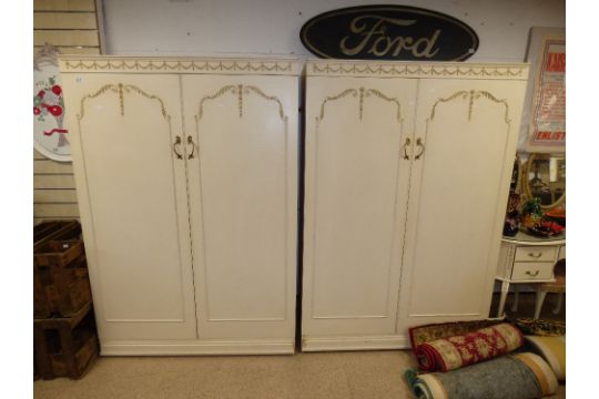 Two Cream And Gilt Decorated Wardrobes With Dressing Table And Cabinet