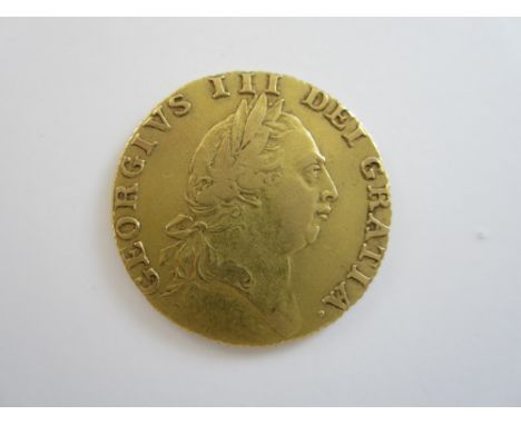 George III,Guinea, 1787, fifth laureate head right, R.Spade shaped shield (S.3729).  Good fine to very fine, reverse better. 