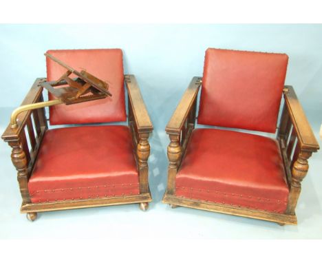 A pair of 1930's oak deep-seated armchairs with adjustable backs, on later castors, one with adjustable oak and bronze readin