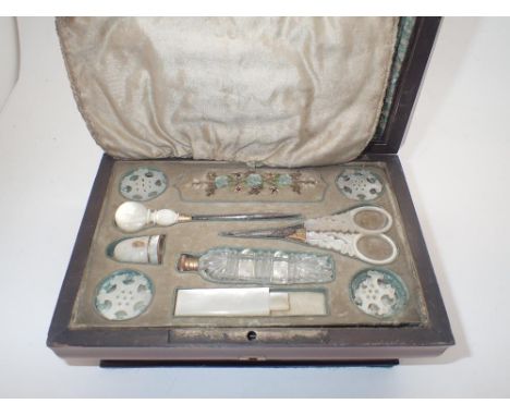 Wooden cased Victorian needlework box with mother of pearl handled contents