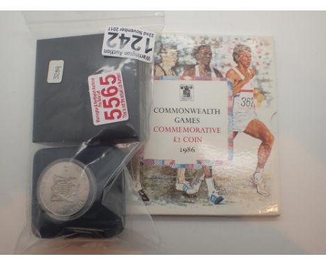 Two cased coins to include Liverpool 2007 and a silver Zambia 1998 and a 1986 £2.00 coin in folder