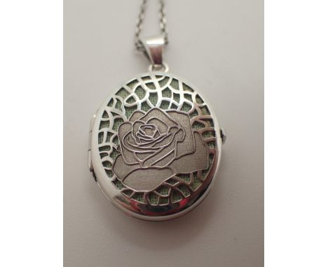 Silver locket with rose decoration on a silver chain