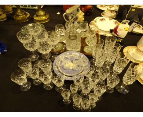 Mahogany tray with decanter and glasses and a large quantity of crystal