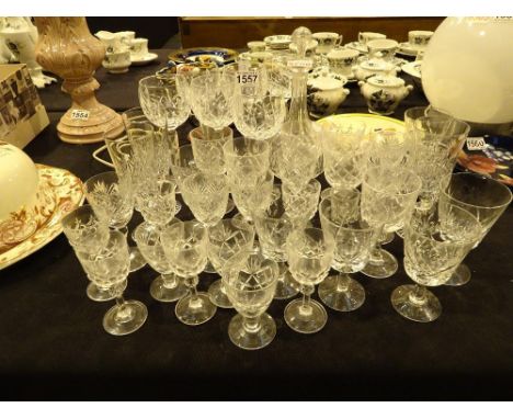 Large collection of crystal drinking glasses and an Edwardian decanter