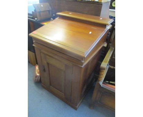 A late 19th/early 20th century walnut ships cabin wash basin having a hinged top revealing mirror and porcelain basin and cup