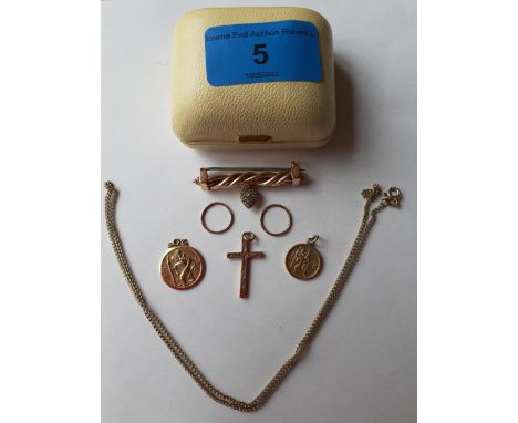 A 9ct gold crucifix, a 9ct gold chain, two 9ct gold circular St Christopher pendants, a pair of yellow metal sleeper earrings