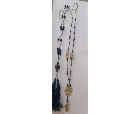 An early 20th Century necklace with Chinese carved jade pendant and interlocking rings along with a silver and enamelled, pie