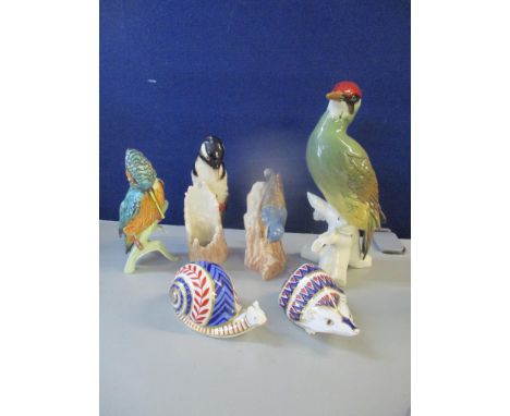 Two Royal Crown Derby paperweights, together with a Karl Ens bird, and three Goebel birdsLocation: 