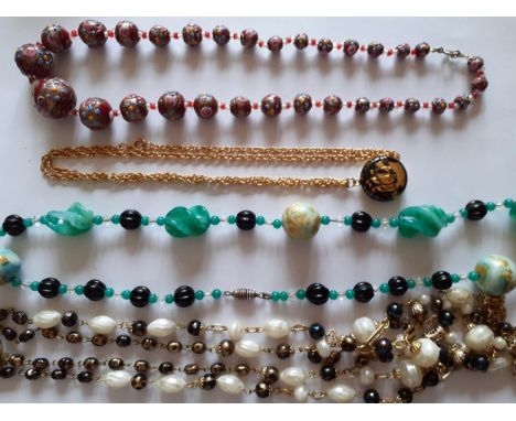 Vintage jewellery to include a Venetian glass bead necklace and a 22ct gold plated locket on chain. Location:RWB 