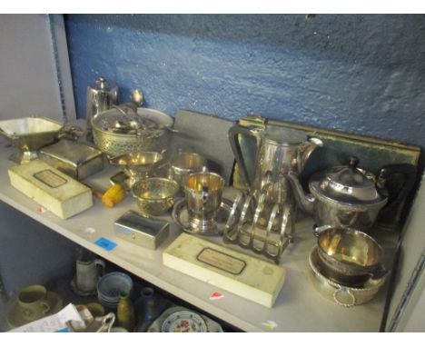 A mixed lot of silver plate to include a cigarette box, toast rack, cutlery, teapot and other itemsLocation: 