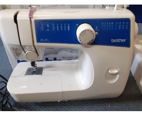 A modern Brother JS-23 sewing machine in original box with instruction manual and CDLocation: RWB 