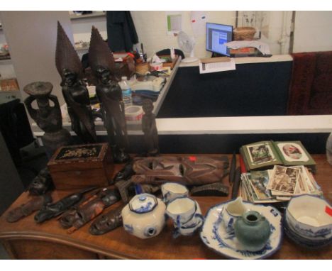 A Royal Doulton tea set, a postcard album and cards, a print and carved tribal figure and masksLocation: STAIRS 