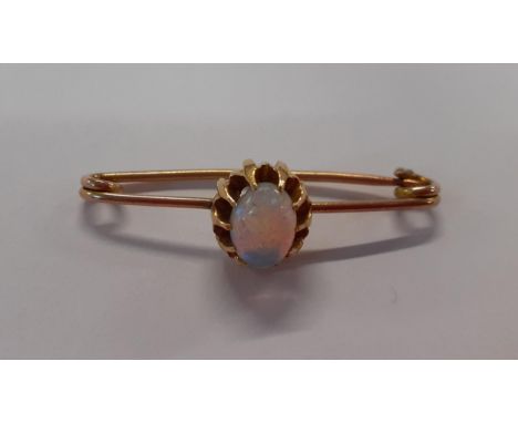 A yellow metal and opal bar brooch, tests as 9ct gold, total weight 2.7gLocation: Cab 