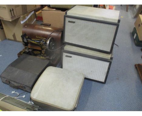 A Singer sewing machine together with a Remington typewriter, a Brother Deluxe typewriter and a Hacker amplifier with a Hacke