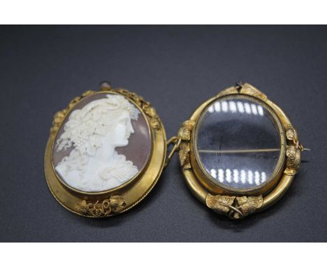A Victorian carved shell cameo brooch depicting profile portrait of a maiden with fruiting vines in her hair, 41x36mm in Pinc