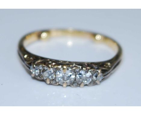 A yellow metal diamond five stone half hoop eternity ring, comprising five graduated Old European cut diamonds and eight 0.8m