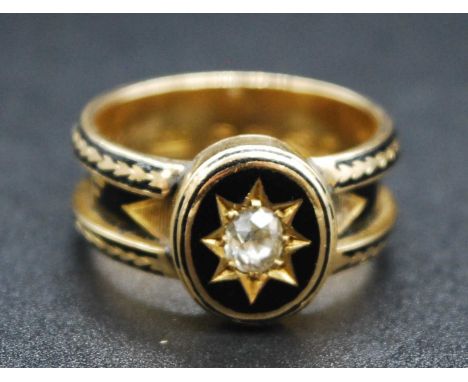 A Victorian 18ct gold, black enamel and diamond set mourning ring, the raised table having a 'gypsy' set old cut diamond weig