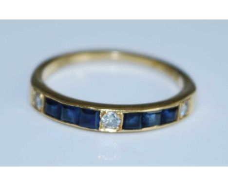 An 18ct yellow gold, sapphire and diamond half hoop eternity ring, comprising two sections each with three channel set square