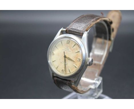A gent's Tudor Oyster-Prince Rotor self-winding stainless steel cased wrist watch having a signed champagne dial (discoloured