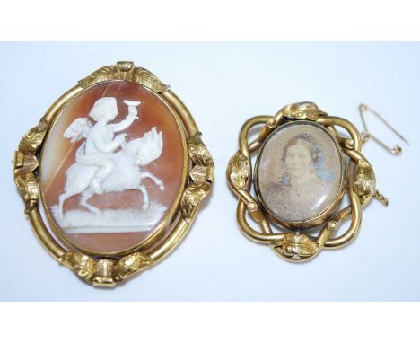 Two brooches, being a yellow metal oval carved shell cameo brooch depicting a cherub riding a horse, 55 x 47mm, gross weight 