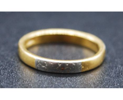 A vintage 22ct gold and part-platinum faced wedding band, the three small platinum sections each having leaf engraved decorat