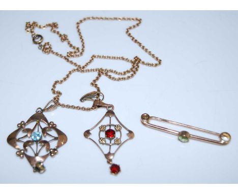 Four pieces of jewellery, comprising a rose metal Edwardian openwork pendant set with two 4.1 x 2.8mm round blue paste stones