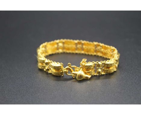 A Chinese high carat yellow metal sectional bracelet, each alternating gate link with twin raised lozenge sections and twin c