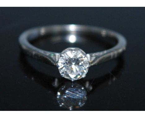 A white metal diamond single stone ring comprising a round brilliant cut diamond in an eight claw setting. Diamond dimensions