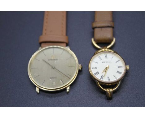 A gents Eterna 14ct gold quartz wrist watch having a signed champagne dial with baton markers, case dia. 32mm (only with half