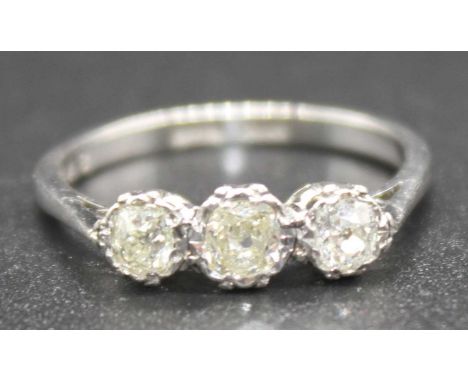 A white metal diamond three-stone ring featuring three graduated old cushion cut diamonds in claw settings, Diamond dimension