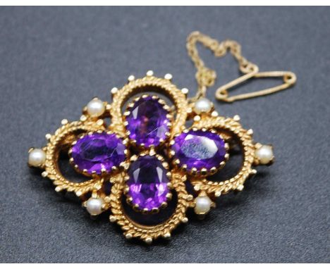 A 9ct yellow gold, amethyst and pearl quatrefoil cluster brooch, comprising four oval faceted amethysts within a rope edge su