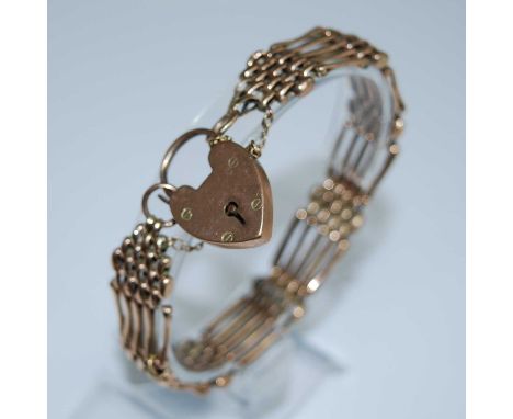 A yellow metal five bar gate link bracelet with padlock and safety chain. length 210mm, width 14mm, gross weight 18.0g, parti