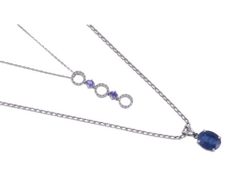 
	
		A DIAMOND AND TANZANITE PENDANT
		The diamond set hoops with oval cut tanzanite's between, approximately 0.18 carats tot