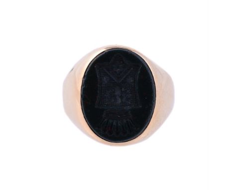 
	
		AN EARLY 20TH CENTURY BLOODSTONE SIGNET RING
		The oval panel carved with the arms of the de Pury family, to a polished 