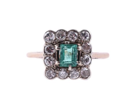 
	
		AN EARLY 20TH CENTURY EMERALD AND DIAMOND SQUARED CLUSTER RING 
		CIRCA 1920
		The step cut emerald with canted corners,