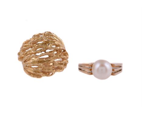 
	
		A GOLD COLOURED DRESS RING AND A CULTURED PEARL RING
		The gold coloured dress ring with a pierced textured foliate fron