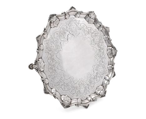 
	
		A GEORGE III SILVER SHAPED CIRCULAR SALVER
		THOMAS HANNAM &amp; JOHN CARTER, LONDON 1765
		With a shell and scroll bord