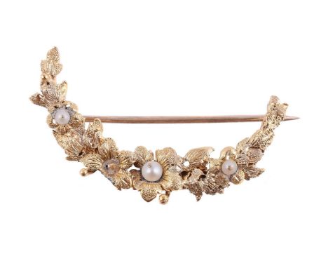
	
		A GOLD COLOURED FLORAL CRESCENT BROOCH
		The crescent of graduated flowers with cultured pearl accents, unmarked
		Size/