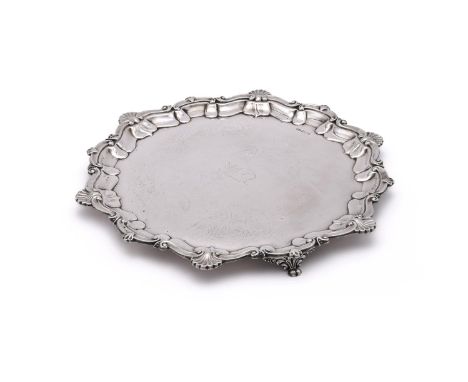 
	
		AN EDWARDIAN SILVER SHAPED CIRCULAR SALVER
		ATKIN BROTHERS, SHEFFIELD 1902
		With a raised shell and scroll border, eng