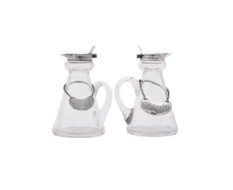 
	
		A PAIR OF SILVER MOUNTED WHISKEY NOGGINS
		HUKIN &amp; HEATH LTD., BIRMINGHAM 1931
		With circular thumb pieces to the f