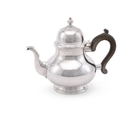 
	
		A SILVER BALUSTER TEA POT
		ROBERTS &amp; BELKS LTD., SHEFFIELD 1979
		With an orb finial to the domed cover, a wood scr
