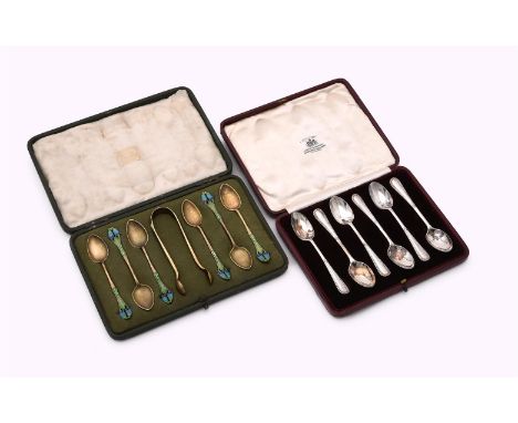 
	
		A NORWEGIAN SET OF SIX SILVER GILT AND ENAMEL TEA SPOONS AND A PAIR OF SUGAR TONGS
		IMPORT MARK FOR BIRMINGHAM 1901
		T