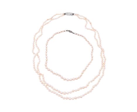 
	
		A CULTURED PEARL NECKLACE WITH A DIAMOND CLASP 
		The two row graduated cultured pearl necklace to an old cut diamond se