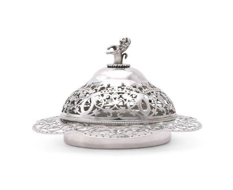 
	
		A VICTORIAN SILVER SHAPED CIRCULAR BUTTER DISH AND COVER
		ROBERT PRINGLE &amp; SONS, LONDON 1898
		With a lion finial t