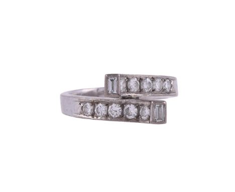 
	
		A DIAMOND CROSSOVER RING
		the crossover panels set with brilliant cut diamonds to a raised terminal with a step cut dia