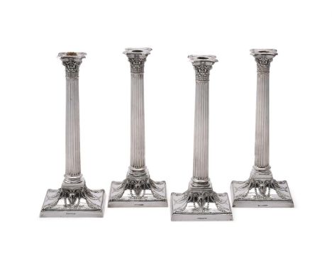 
	
		A SET OF FOUR ELECTRO-PLATED CORINTHIAN CANDLESTICKS
		WALKER &amp; HALL
		With beaded borders to the sconces, foliate c