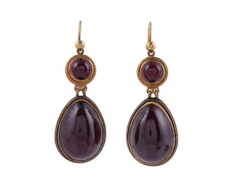 
	
		A PAIR OF GARNET DROP EARRINGS
		The pear shaped cabochon garnet drops within rope twist settings to circular cabochon g