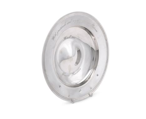 
	
		A SILVER ARMADA DISH
		ASPREY, LONDON 2003
		With a reeded border and engraved with a presentation inscription
		20cm (8